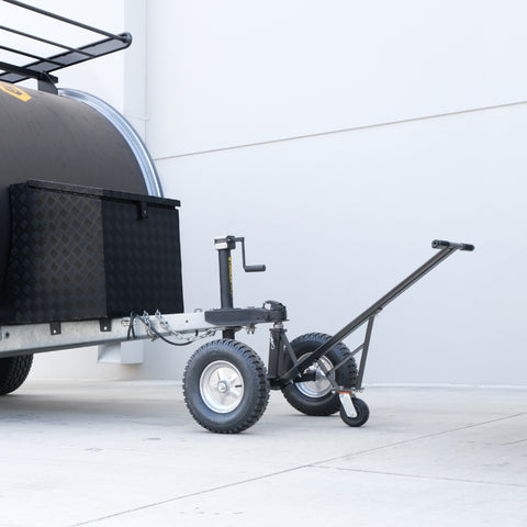 Lifestyle photo of the Trailer Valet Standard Bundle connected to trailer – compact dolly and jack in use - TVEHADB1