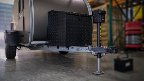 Wide view of PJX3500 jack on trailer during outdoor setup